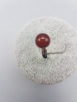 A Red Carnelian Solitaire Ring with a red stone on it.