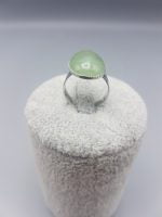 AN OVAL GREEN AVENTURINE RING 18X13 with green jade stone.