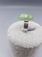 AN OVAL GREEN AVENTURINE RING 18X13 with green jade stone.