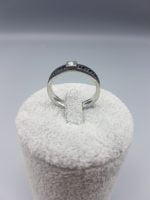 A steel ring with glitter at the top.