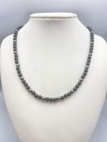 A MEN'S NECKLACE WITH BLACK ONYX AND HEMATITE 6 MM beaded necklace on mannequin.