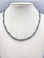 A necklace with beads MEN'S NECKLACE WITH BLACK ONYX AND HEMATITE 4MM on mannequin.