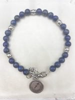 A MEN'S BRACELET WITH LAPIS LAZULI AND SAGITTARIUS PENDANT with silver charm.