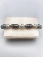 A MEN'S BRACELET WITH MOSS AGATE AND BLACK ONYX black and silver in a box.