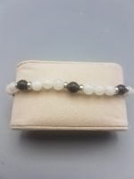 A BLACK AND WHITE CANCER PENDANT BLACK MOONSTONE & ONYX MEN'S BRACELET in a box.