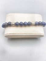 A MEN'S BRACELET WITH LAPIS LAZULI AND SAGITTARIUS PENDANT beaded bracelet on box.