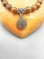 A BRACCIALE DI BRONZITE CON CIONDOLO ALBERO DELLA VITA con charm albero della vita in argento.
