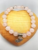 An 8 MM ROSE QUARTZ BRACELET with a HEART pendant in sterling silver.