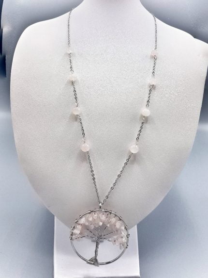 A ROSE QUARTZ TREE OF LIFE NECKLACE with a rose quartz tree.