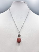 A necklace with a RED JASPER PENDANT.