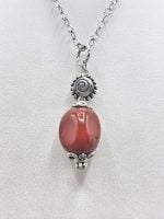 A necklace with a RED JASPER PENDANT on a silver chain.
