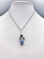 A Sodalite Angel Pendant with an Angel and a Sodalite stone.