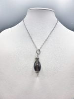 Una collana con pendente CIONDOLO DI QUARZO FUME' BARILOTTO.