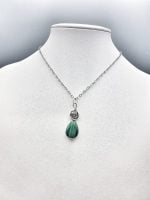 A green MALACHITE PENDANT.