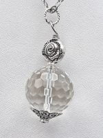 ROCK CRYSTAL SPHERE PENDANT with a silver chain.