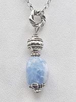 A CHALCEDONY BARREL PENDANT with a blue chalcedony stone.