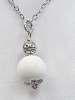SPHERICAL WHITE AGATE PENDANT on silver chain.