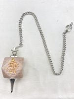 An incense burner with the MOONSTONE PENDULUM AND OM SYMBOL on it.