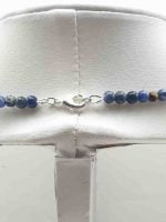 A MEN'S CHOKER NECKLACE WITH SODALITE AND TIGER'S EYE STONES DIAMETER 4 MM with blue and brown beads on mannequin.