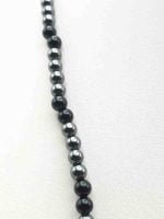 A Men's Necklace with 4mm Black Onyx and Hematite on a white surface.
