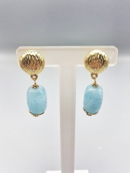 A pair of AQUAMARINE CLIP EARRINGS with aquamarine accents.