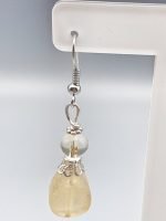 A pair of CITRINE DROP QUARTZ EARRINGS.
