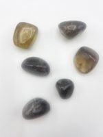 Group of stones TUMBLED SMOKY QUARTZ on a white background.