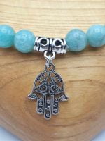 An amazonite bracelet with a hamsa amulet.
