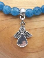 An ANGELITE BRACELET with a silver charm.