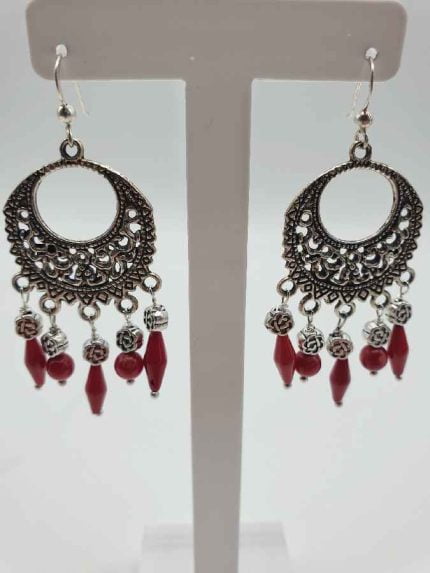 A pair of hanging coral earrings.