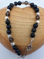 MEN'S BRACELET WITH OBSIDIAN AND SMOKY QUARTZ WITH CAPRICORN PENDANT for men with black and silver beads and silver clasp.