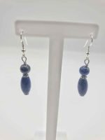 A stand displaying elegant earrings DROP LAPIS LAZULI EARRINGS.