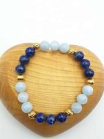 A bracelet with aquamarine and golden lapis lazuli.