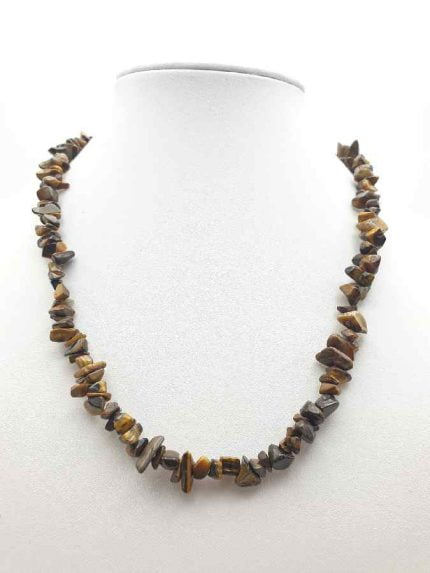 A mannequin with TIGER'S EYE MEN'S NECKLACE CHIPS, THE STONE OF WILL, which represents the stone of willpower.
