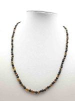 A necklace with tiger's eye and black onyx pearls on a mannequin - MEN'S NECKLACE WITH TIGER'S EYE AND BLACK ONYX 4MM