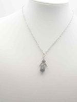 A chain with a LAPIS LAZULI ANGEL pendant and a silver ring.