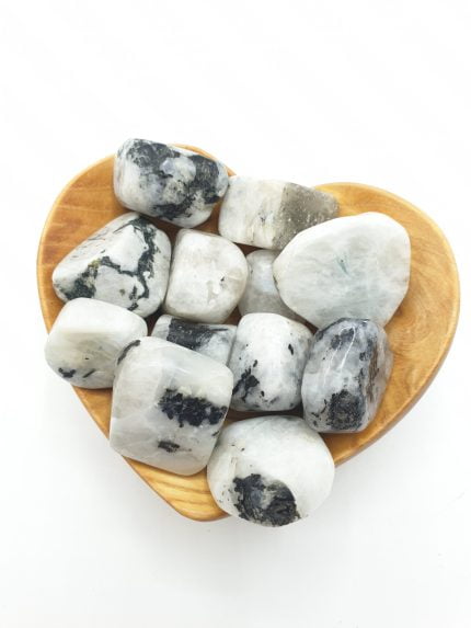 Heart-shaped wooden bowl filled with TUMBLED WHITE MOONSTONE.