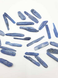A bunch of KYANITE STICKS OR TUMBLED DISTENE blue crystals.
