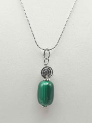 A malachite pendant pendant on a silver chain.