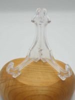 A plexiglass display on a wooden base for agate slices.