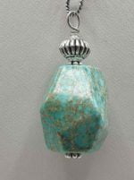 An imperial jasper pendant on a silver chain.