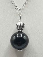 A black onyx pearl necklace with a BLACK TOURMALINE BALL PENDANT PENDANT.