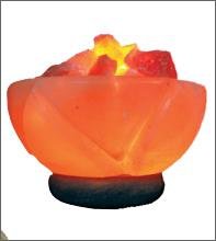 A red BRAZIER SALT LAMP with a candle inside.