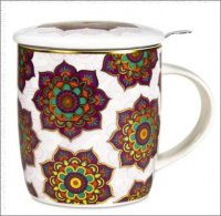 A RED MANDALA INFUSER MUG with a mandala pattern on top.