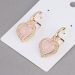A pair of earrings BRONZE EARRINGS WITH ZIRCONS AND CAT'S EYE HEART.