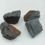 Four pieces of natural raw hematite on a white surface
