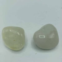 Two pieces of white jade on a white background, Tumbled Sulphurous Quartz.