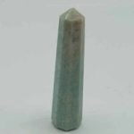 AN AMAZONITE OBELISK in amazonite on a white background.