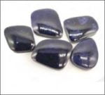 Collection of ZAFFIRO BLU TUMET stones on a white background with tumbled finish.
